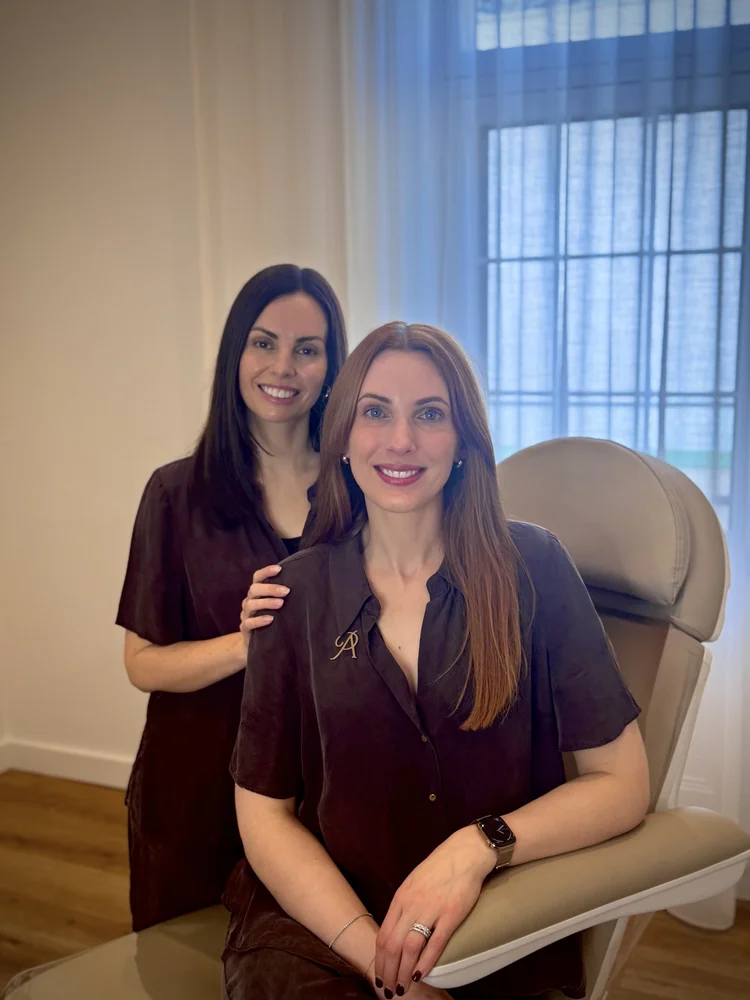 Two registered nurses in the treatment room at Peach Aesthetics Co